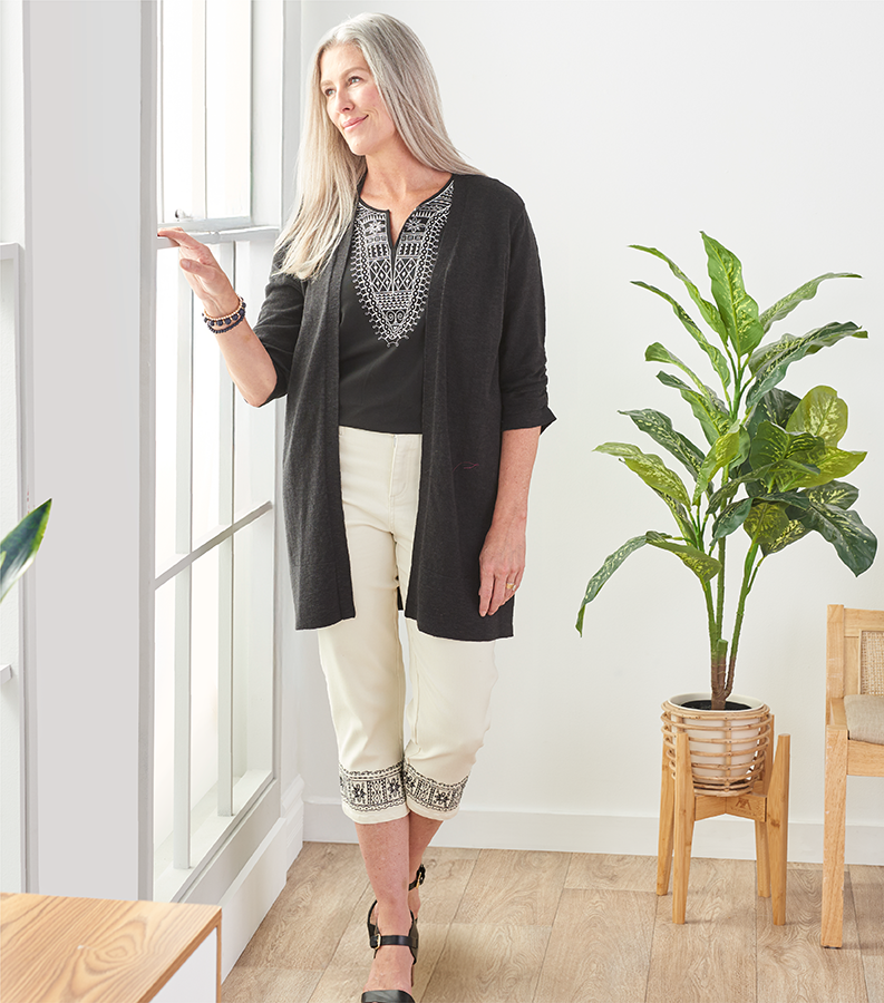 Artisan Details: Crafted details that bring warmth and soul to every stitch. Featuring a black embroidered top and white embroidered hem capri.