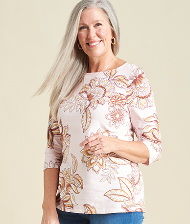 Explore our knit tops! Featuring a white floral print tee.