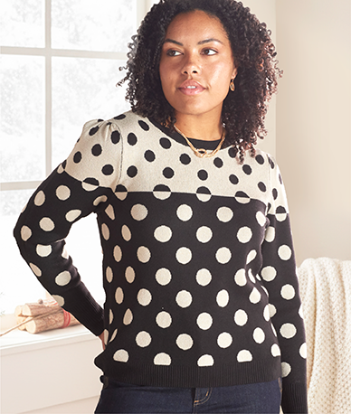 Explore our sweaters! Featuring a mixed polka dot sweater.