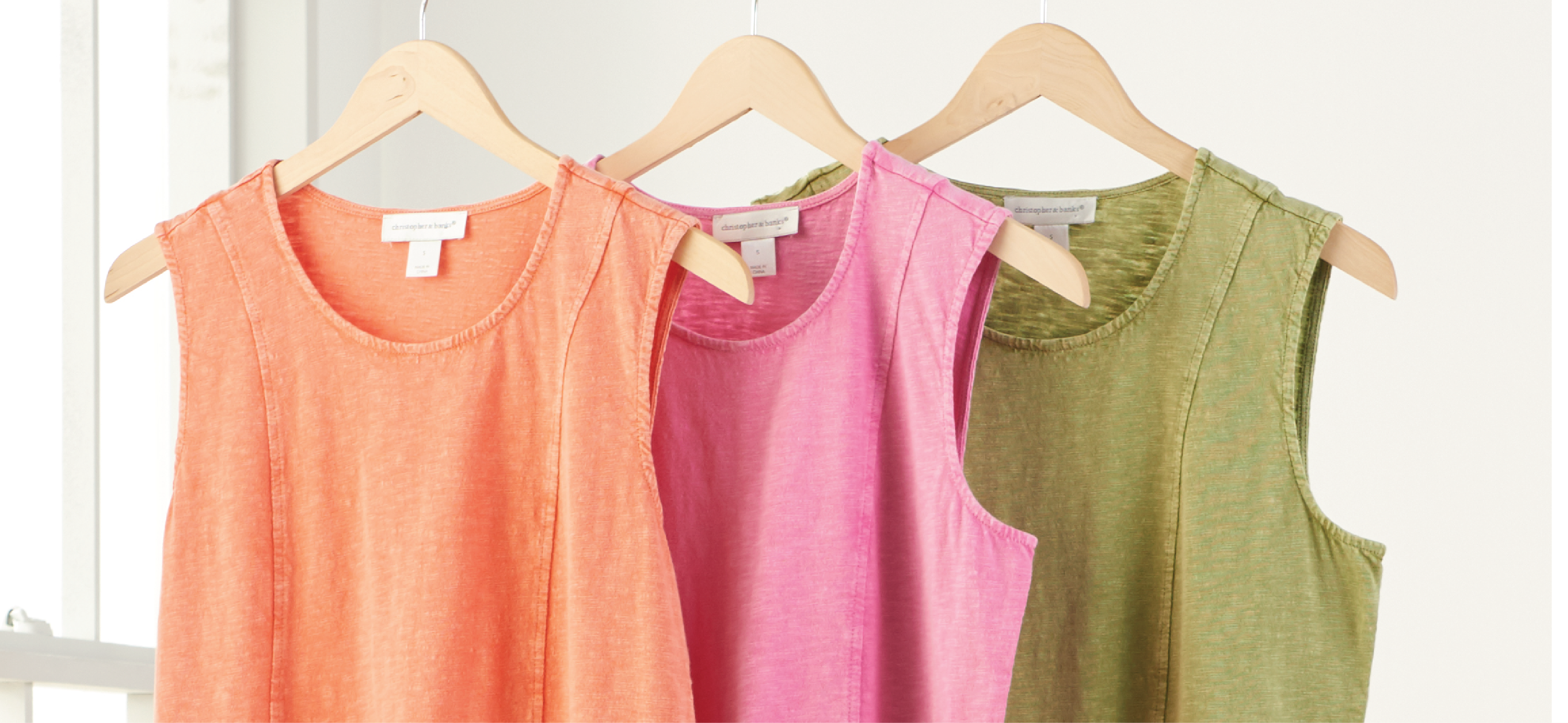 Featuring an orange, pink, and green sleeveless lace hem top!