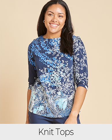 Explore our knit tops! Featuring a blue embellished swirl print tee.