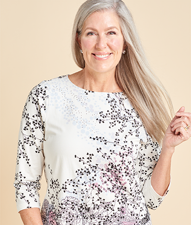 Explore our knit tops! Featuring a white embellished swirl print tee.