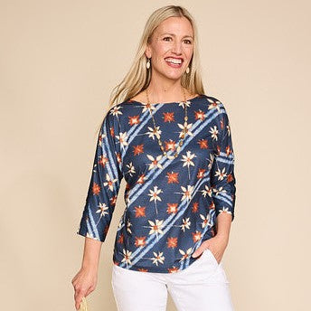 Explore our knit tops! Featuring a blue dye effect print top.