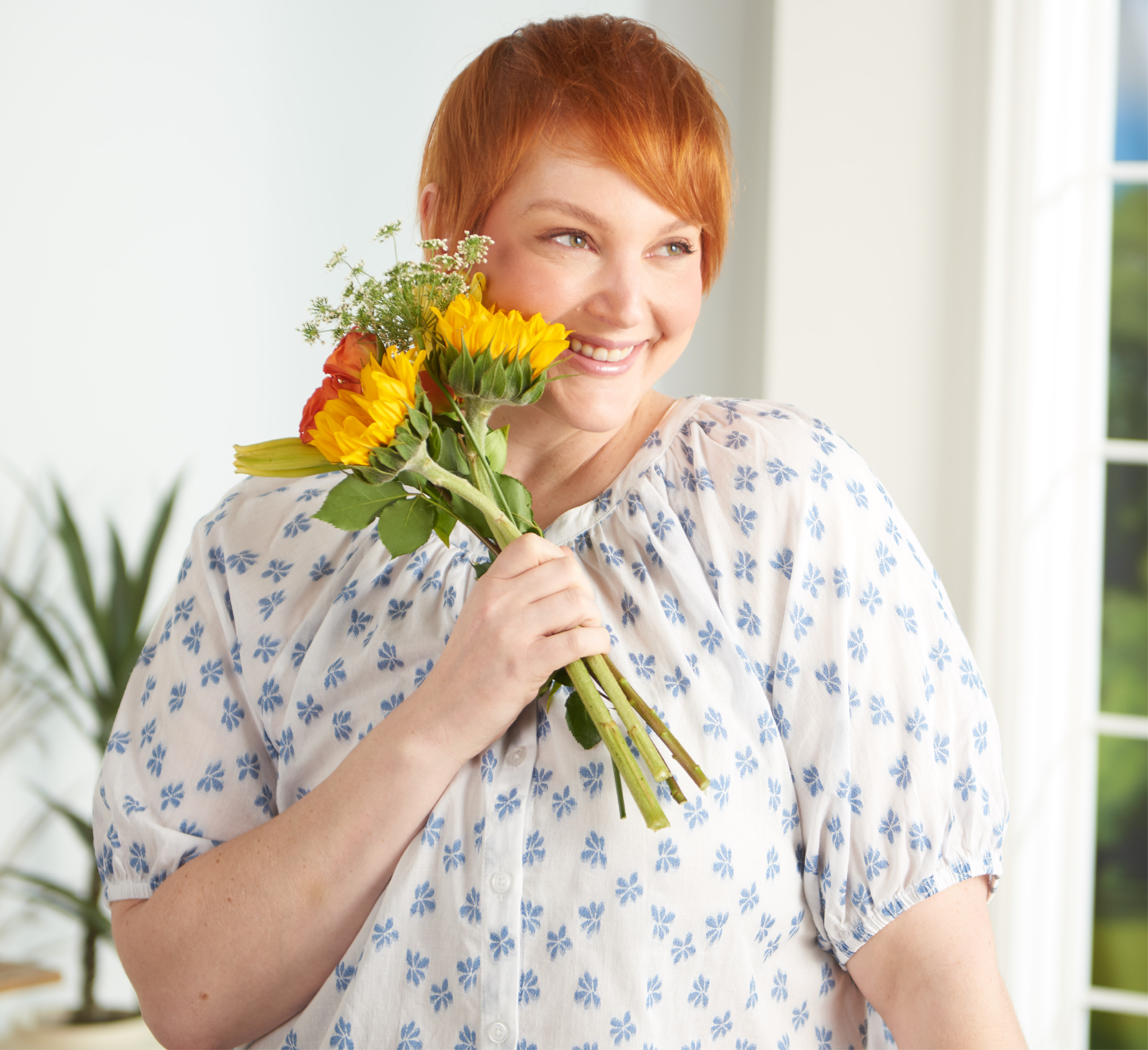 Featuring a blue floral clip dot top!