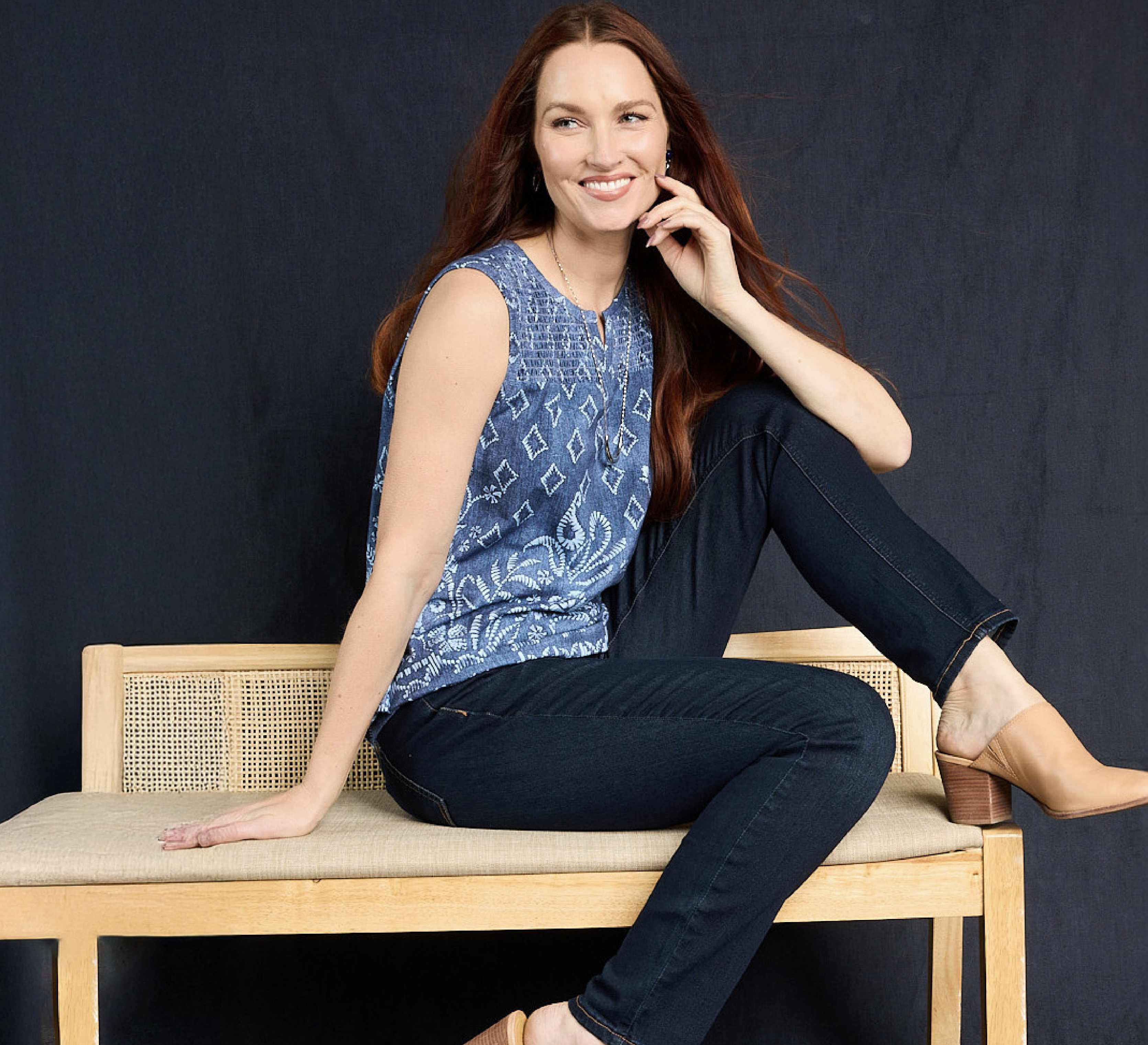 Explore our new arrivals! Featuring a blue top and jeans.