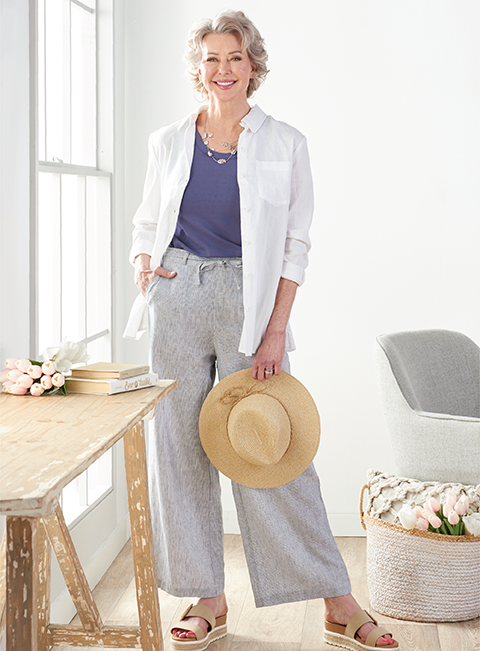 Featuring a white linen blend shirt and pinstripe linen pants.