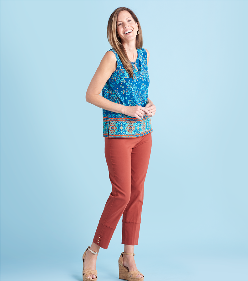 Featuring a blue border print top and brown millennium capris.