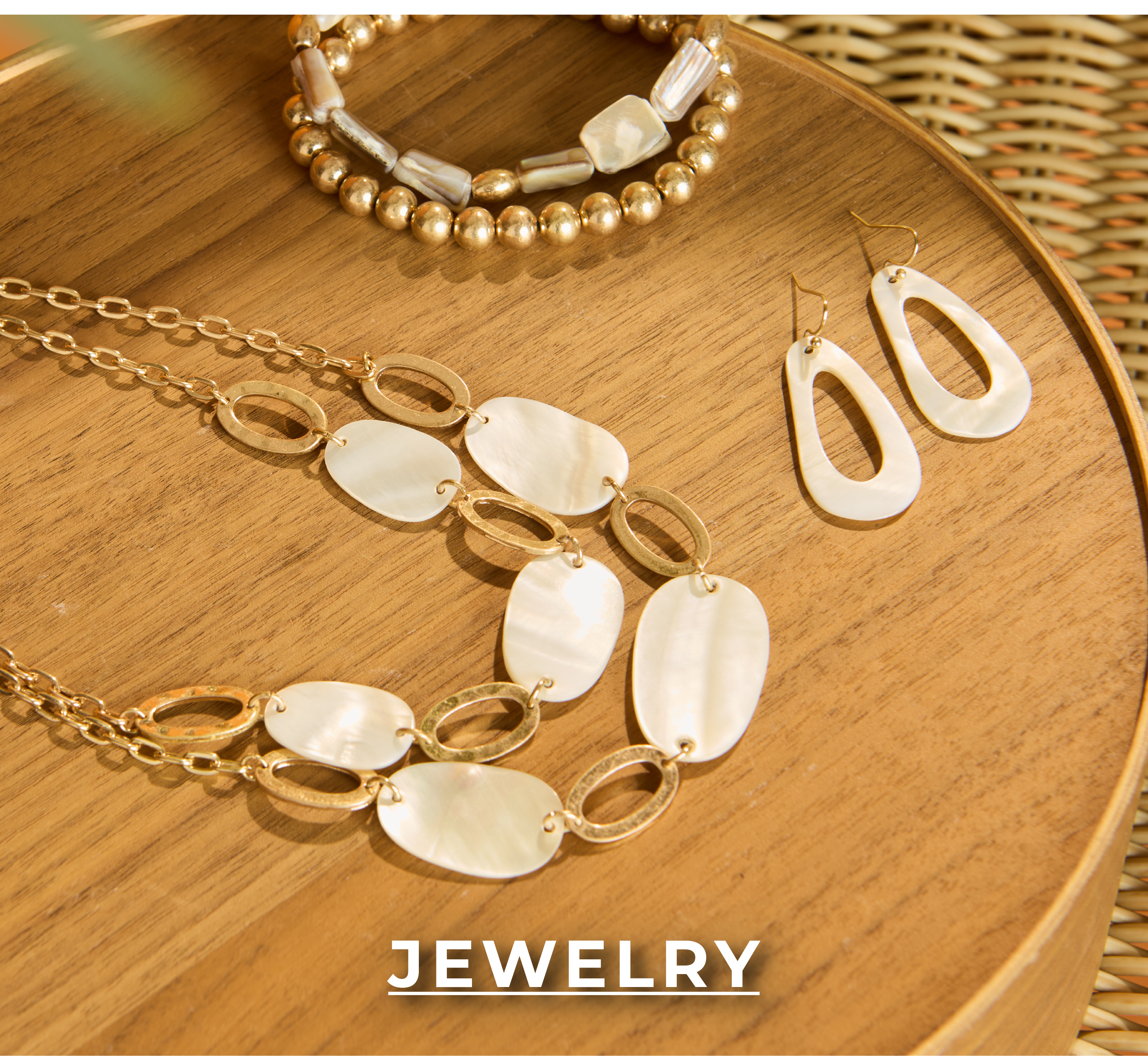 Jewelry. Explore our jewelry! Featuring a layer chain shell necklace, shell drop earrings, and multi stone stretch bracelet.