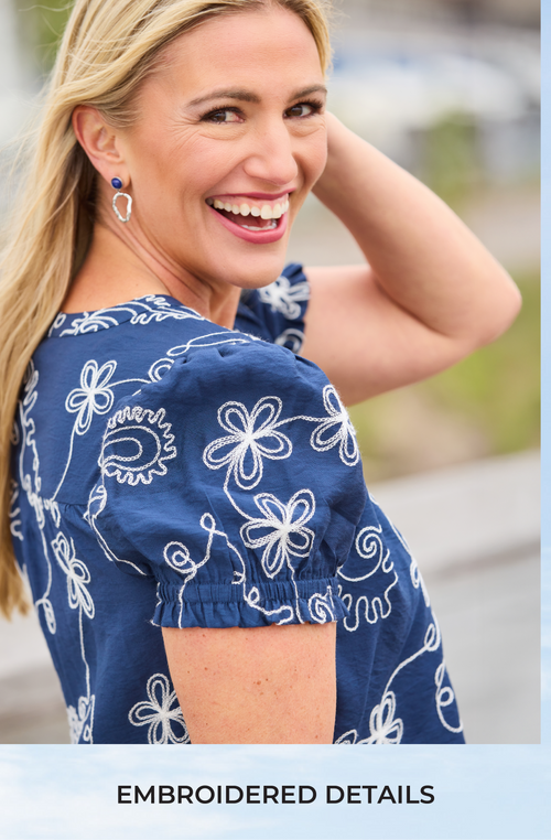 Embroidered Details: Featuring a blue embroidered blouse.