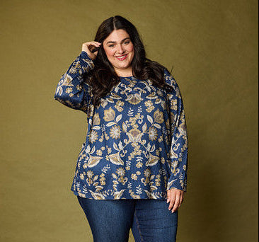 Explore our knit tops! Featuring a floral blue top.