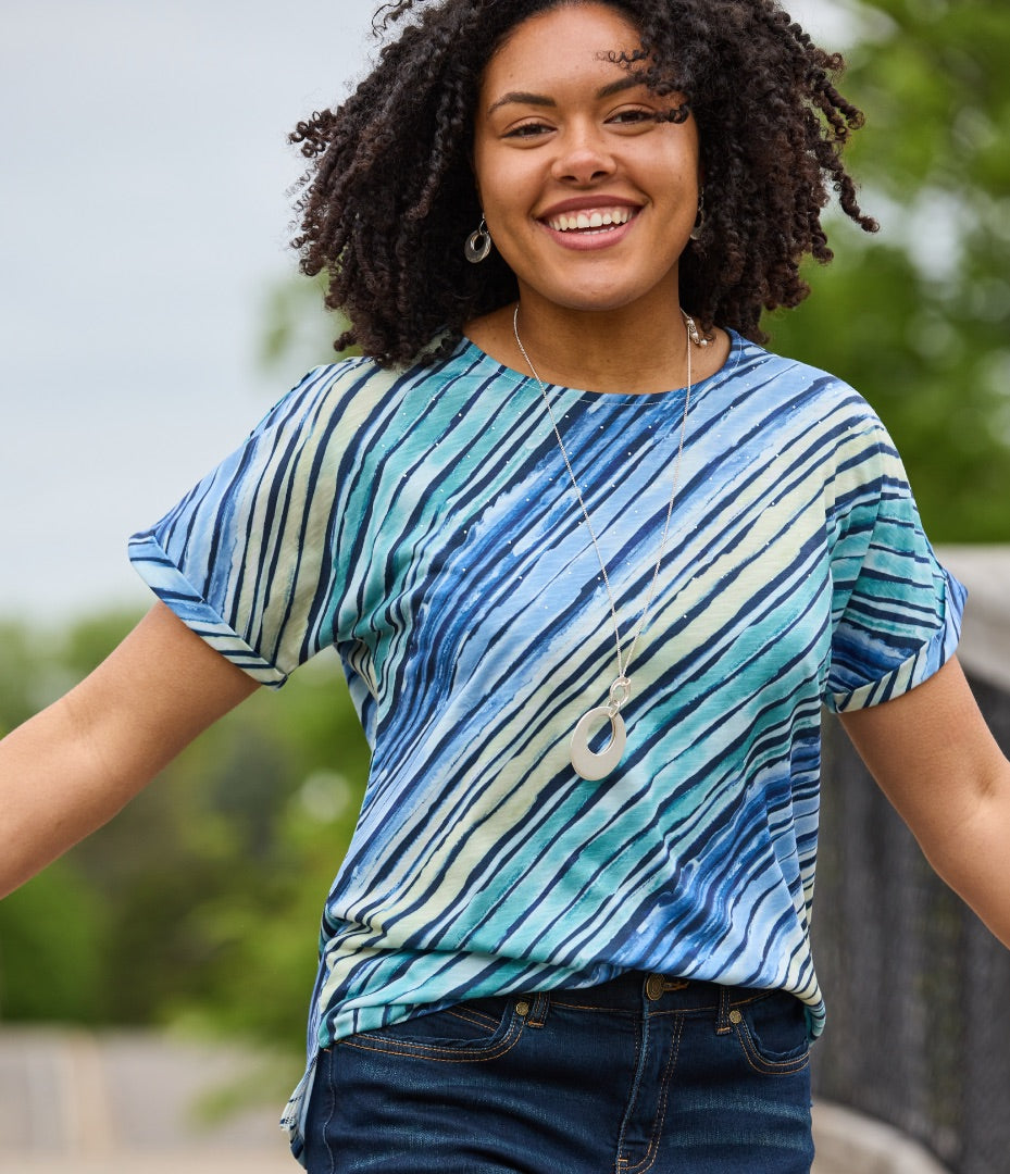 Explore our summer styles collection! Featuring a blue watercolor stripe tee.