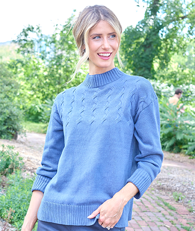 Explore our sweaters! Featuring a blue mock neck sweater.