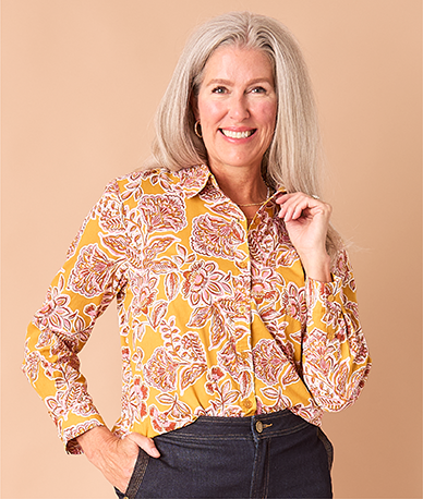 Explore our blouses & shirts! Featuring an orange floral shirt.