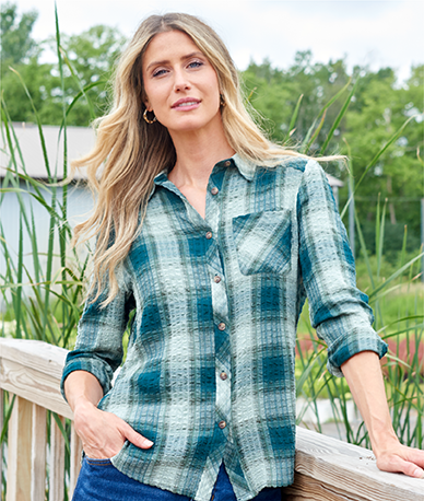 Explore our blouses & shirts! Featuring a blue plaid shirt.