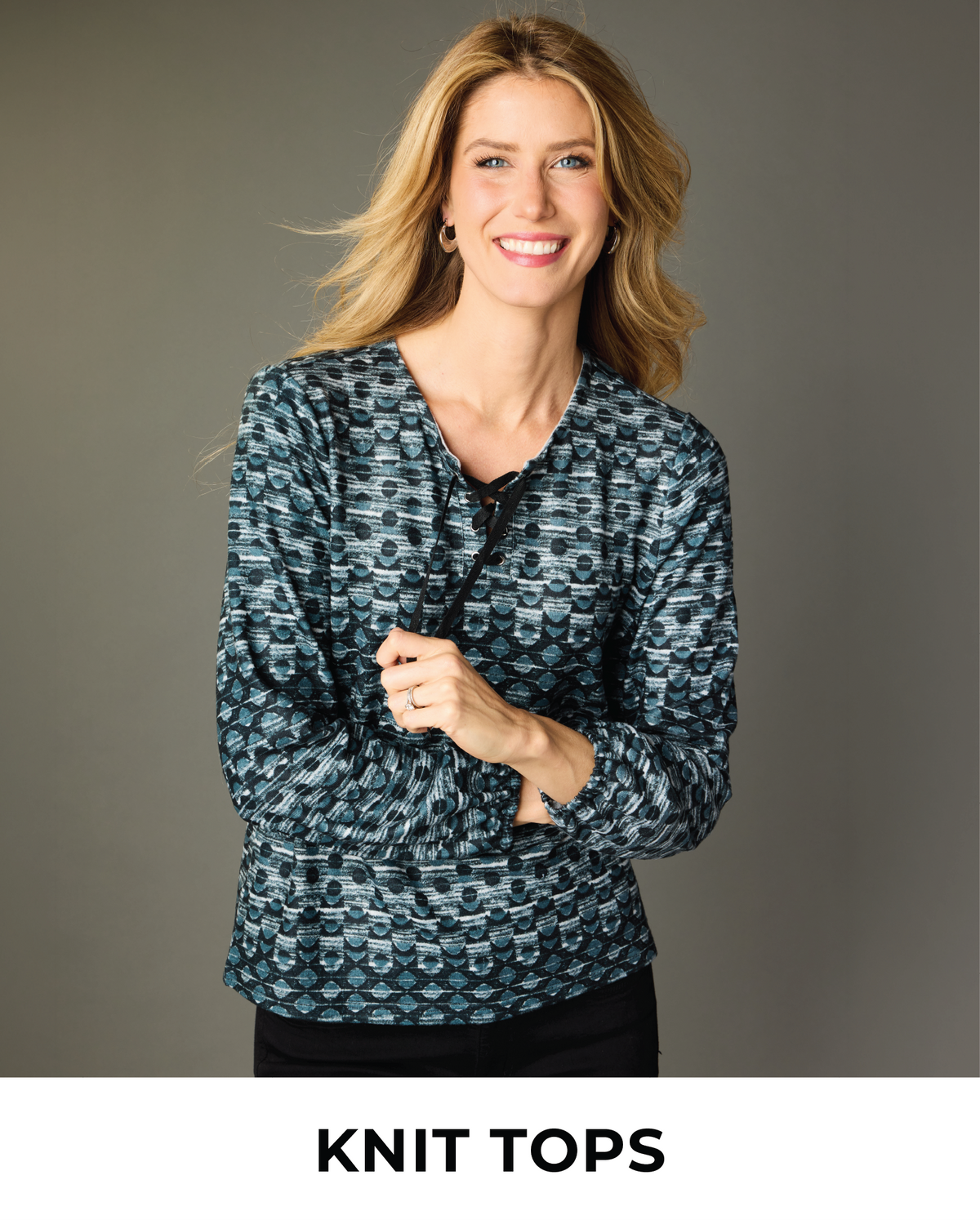 Explore our knit tops! Featuring a grey lace up neckline top.