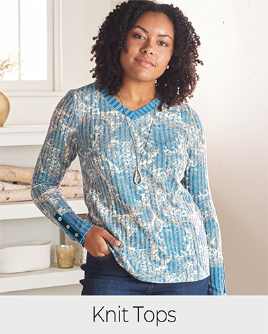 Explore our knit tops! Featuring a blue floral print tee.