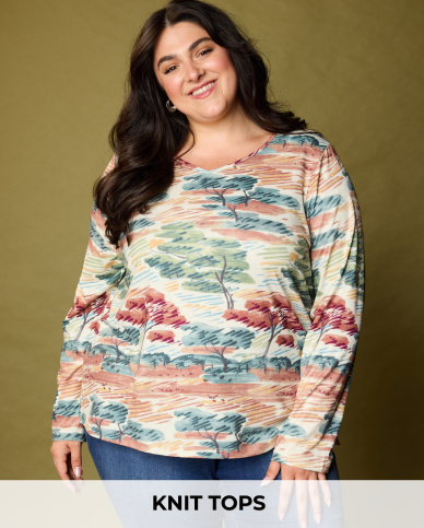 Explore our knit tops! Featuring a white watercolor scenic print tee.