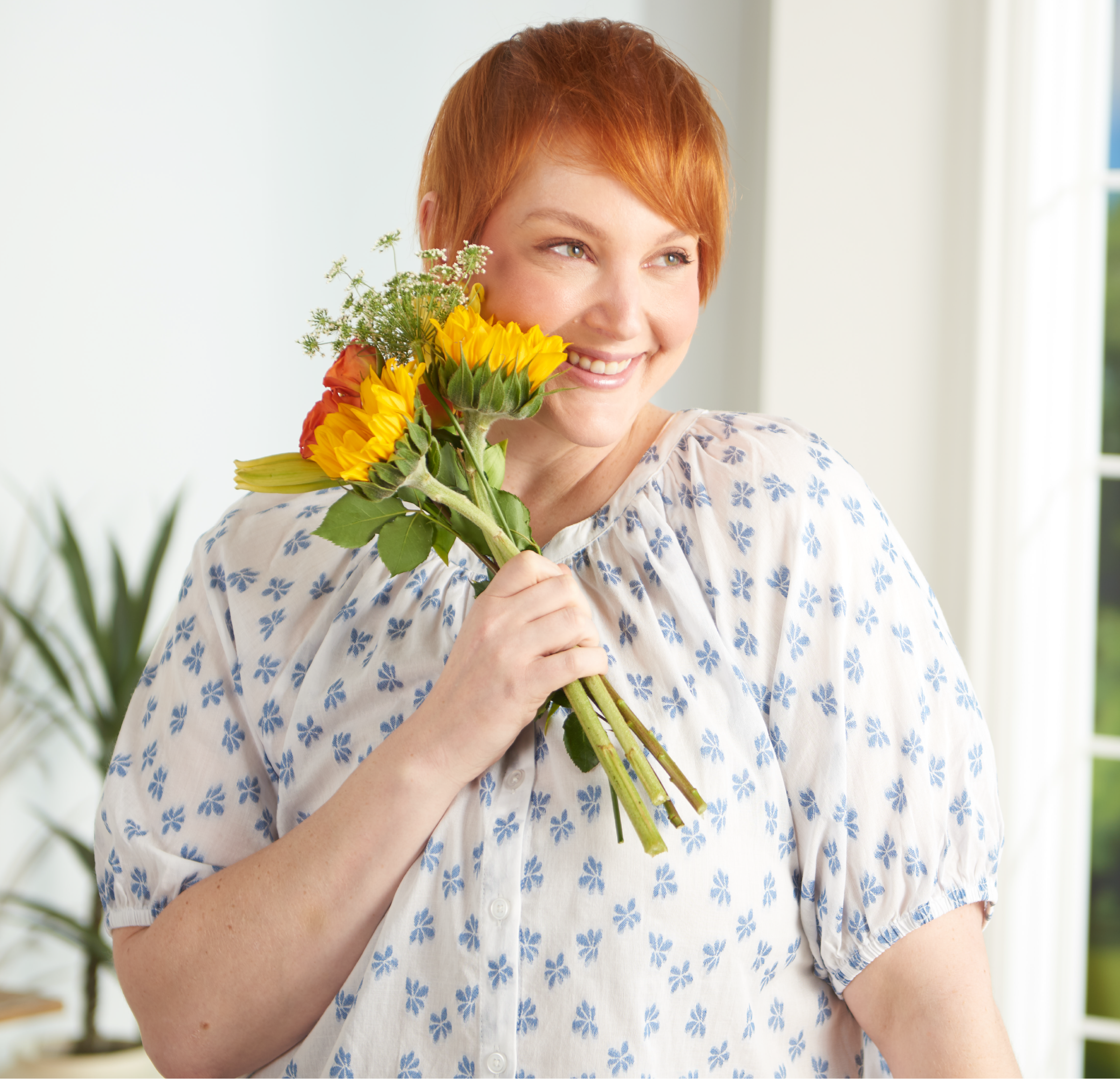 Featuring a blue floral clip dot top!