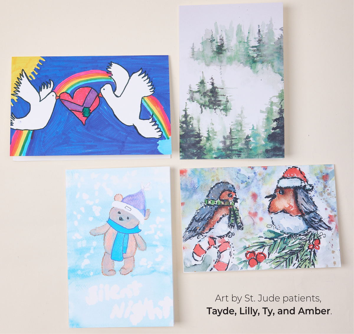 Featuring an assortment of St. Jude Patient Artwork Greeting Cards. Art by St. Jude patients, Tayde, Lilly, Ty, and Amber.