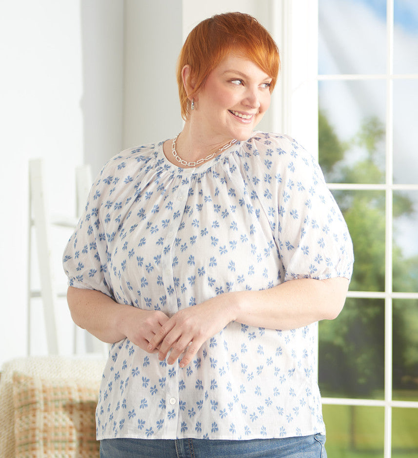 Explore our blouses & shirts! Featuring a blue floral clip dot top.