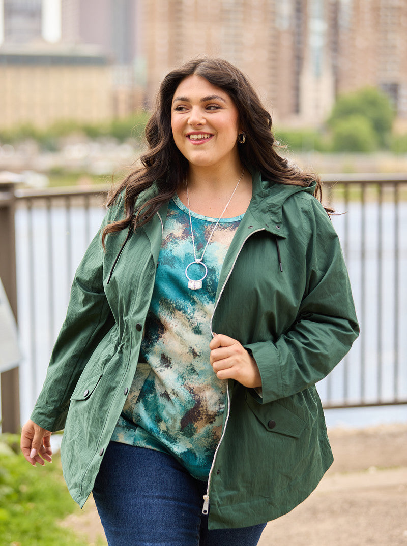 Explore our relaxed restyled collection! Featuring a blue abstract print tee and green hooded rain jacket.