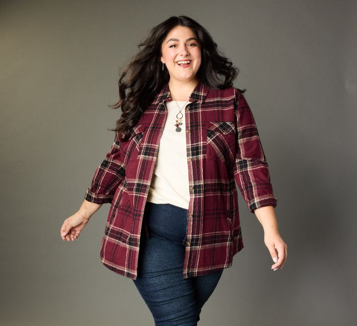 Explore our blouses & shirts! Featuring a burgundy plaid tunic.