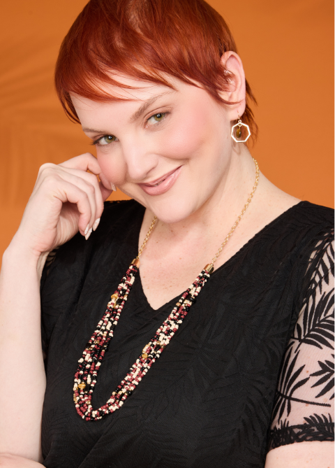 Explore our jewelry! Featuring a brown long multi beaded chain and hexagon tiger eye earring.